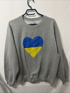 USA Made The Shop Forward Gray Sweatshirt with Blue and Yellow Heart Graphic